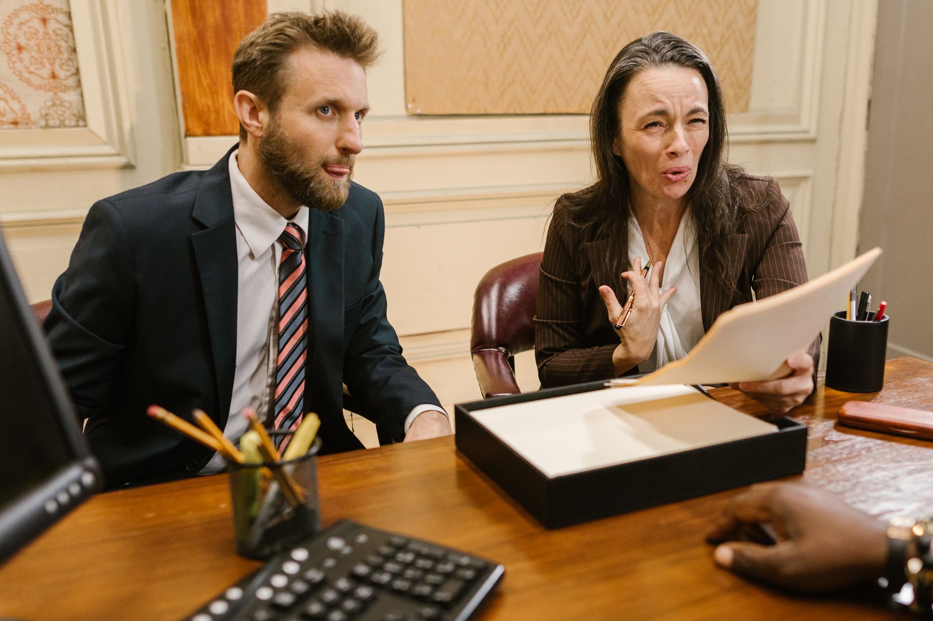 Lawyers discussing legal documents in a professional office setting. — Access Reliable Coverage Insights Through Professional